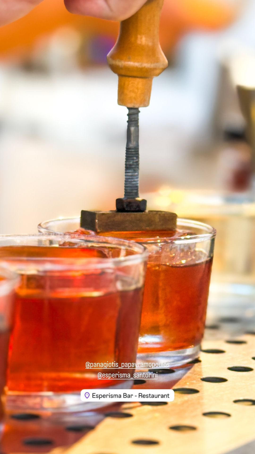 Branding stamp pressed onto clear ice for a signature serve