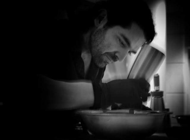 Low-light preparation over the mixing bowl during service