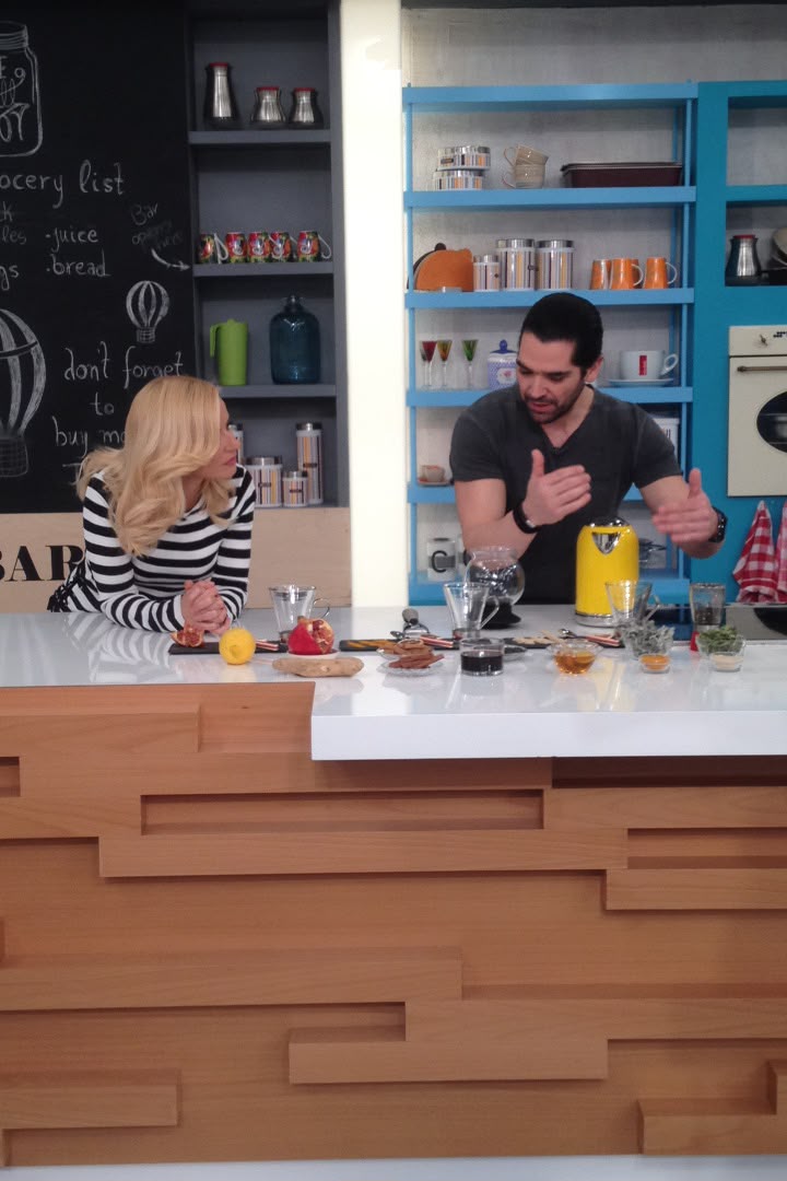 Explaining an infusion to the presenter across the studio counter